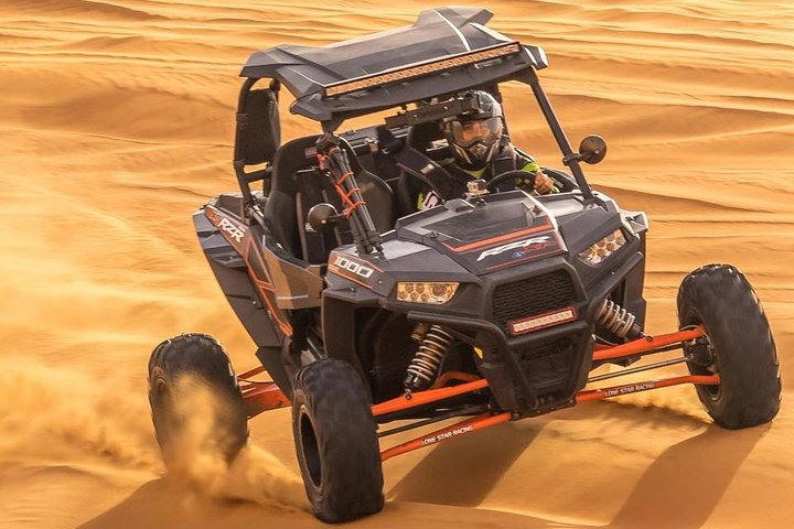 Experience the excitement of driving a 1000cc Polaris buggy across stunning desert landscapes with expert guidance and a unique dinner and live shows to enhance your adventure.